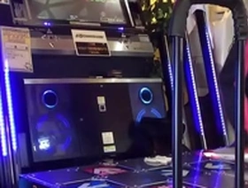 Gay Japanese man enjoys DDR with a hard cock