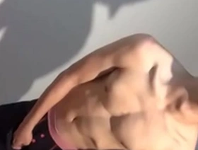 Gay sports club member flaunts his large penis on camera.